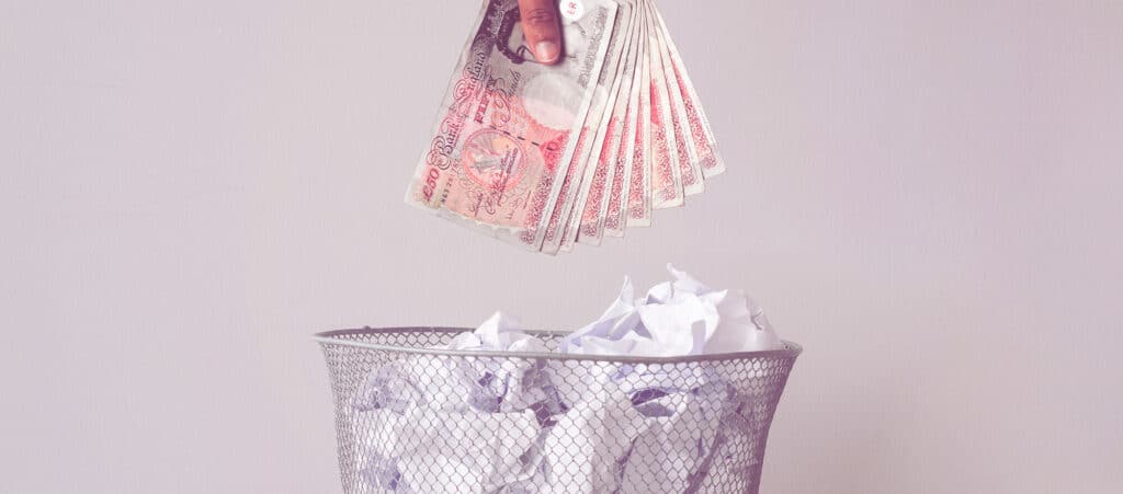 Common bookkeeping mistakes in recruitment agencies, showing UK pound notes being discarded to represent lost profits, poor financial management and accounting errors in staffing businesses.