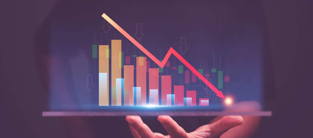 A digital stock market graph showing a sharp decline with a red arrow pointing downwards, symbolising the financial risks and expensive mistakes faced by recruitment agencies without proper bookkeeping or accountancy services.