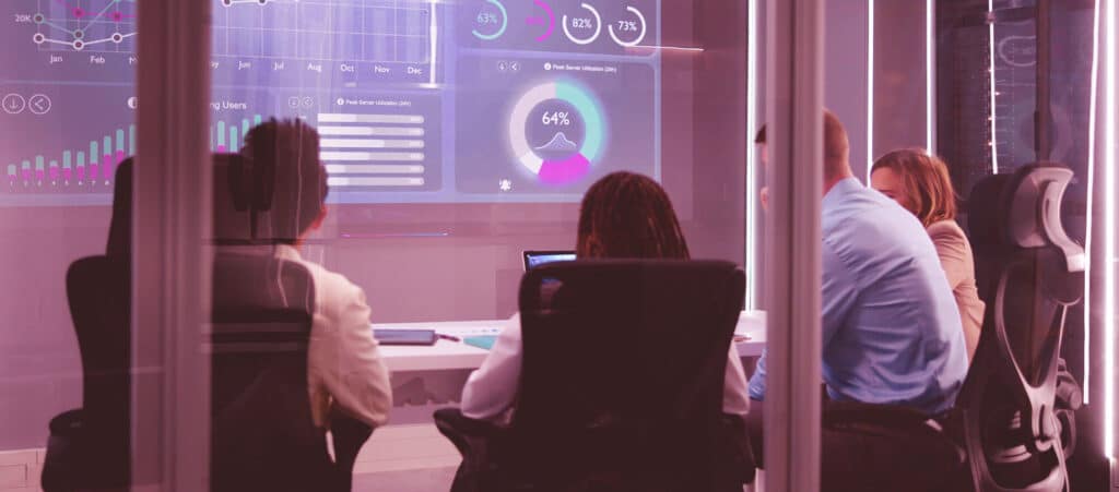 A small recruitment agency reviewing financial KPI dashboards during a monthly or quarterly board meeting.
